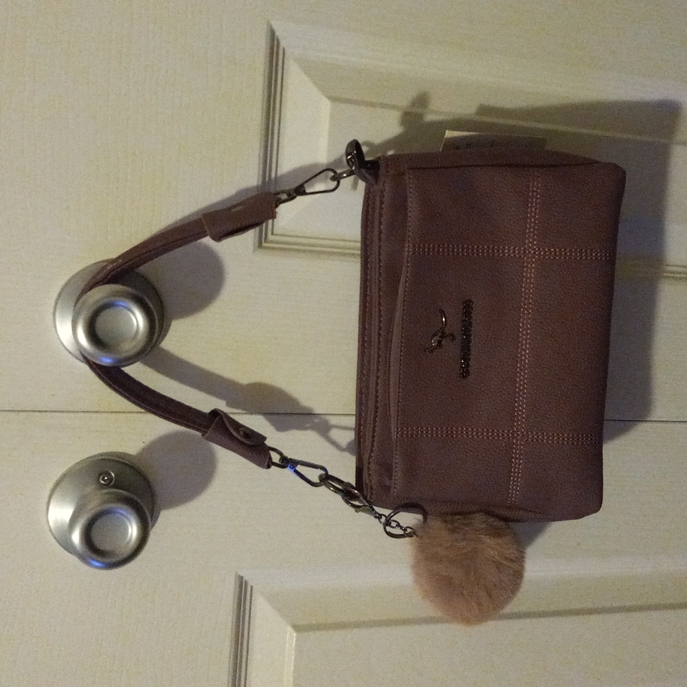 Crossbody purse that converts to a hand bag. Approx. 7×10 purple